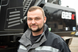  Robin Reindel, Technical Director at SWRN with the extraordinarily painted material handler 